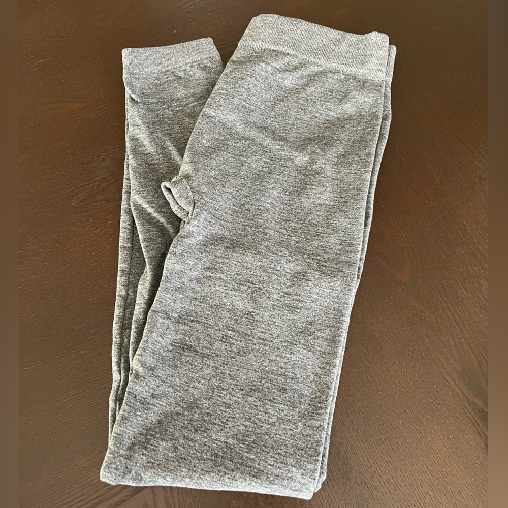 2 grey leggings and 1 black